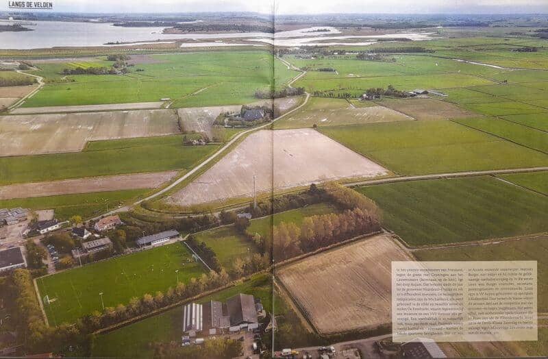 Uitgestrekt landschap met velden en wateren in Friesland.